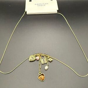 NWT American Eagle Outfitters Gold Tone Heart Charm Necklace with Charms
